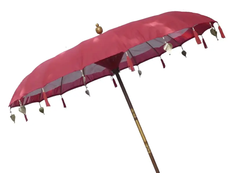 Product image of the product “Bali umbrella , red with wooden coins and gold leaves hanging around the edge. Approx. 230cm dia. and 250cm height ”